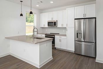 Quartz countertops in kitchen and bathrooms